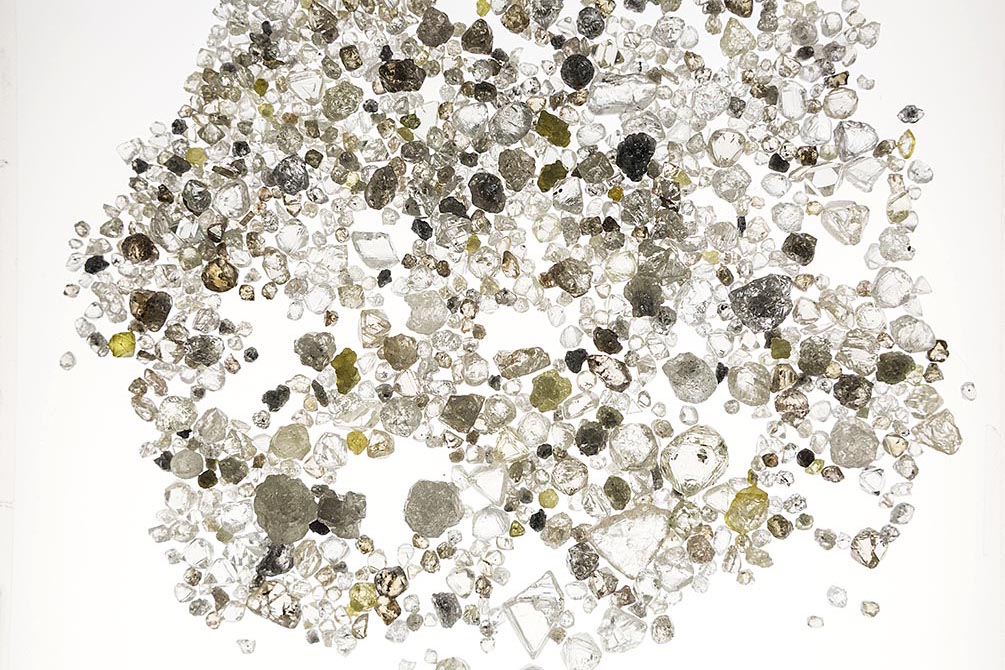Rough diamonds arranged on a light box at the De Beers office in London. Photo Nicholas Andrews