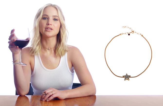 Jennifer Lawrence wearing Selim Mouzannar diamond star choker seen at right in her pitch to win a wine tasting with her to benefit the Omaze charity.