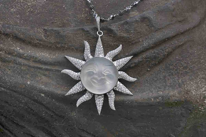 Cynthia Bach Sun Moon pendnat with a rock crystal carving and diamond and platinum sun motif Photo by Sally Davies