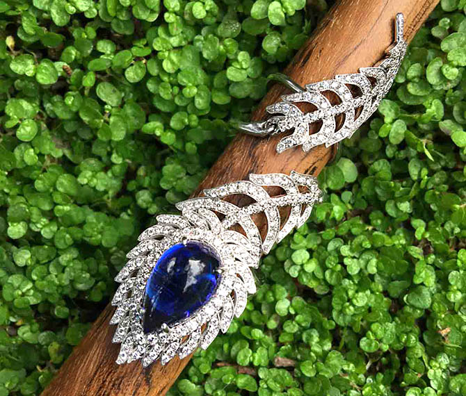 Cynthia Bach's peacock feather diamond and platinum ring has an 8.14-carat pear-shape Tanzanite cabochon in the eye.  The bold design winds around the upper and lower parts of the finger. Photo by Sally Davies
