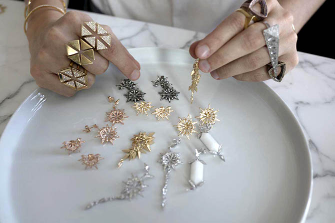 Designer Karma El Khalil arranging a selection of jewelry from her collection Photo by Sally Davies