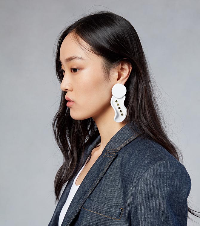 Model from the Tibi show wearing the black spinel and white ceramic earring done in collaboration with Paige Novick and Githan Coopoo Photo courtesy of Tibi