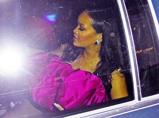 Rihanna arriving at her 30th birthday party wearing Verdura earrings