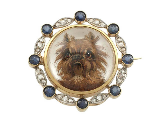 Antique brooch with a crystal portrait of a Brussels Griffon set in a gold, diamond and sapphire brooch