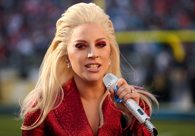 Lady Gaga wore Lorraine Schwartz diamond studs and her heart shape engagement ring from Taylor Kinney at the 2016 Super Bowl. Photo Getty