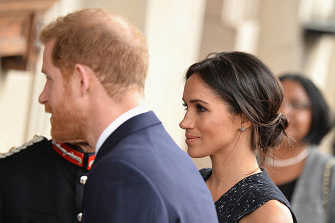 Prince Harry and Meghan Markle who is wearing her new Cartier diamond earrings at the 25th Anniversary Memorial Service to celebrate Stephen Lawrence on April 23, 2018 in London, England. Photo Jeff Spicer/Getty Images