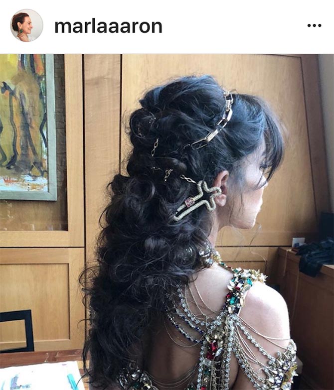 Marla Aaron showed just how 360-views of MET Gala attendees can be with Instagram photo of director Reed Morano who was wear the designers Cross Lock necklace in her hair. 