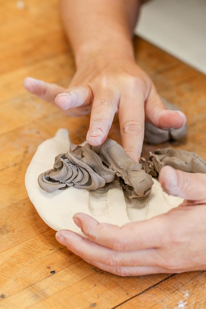 Ineke Heerkens working with clay to form ceramic elements for her jewels. Photo Rod Morata: Michael Priest Photography