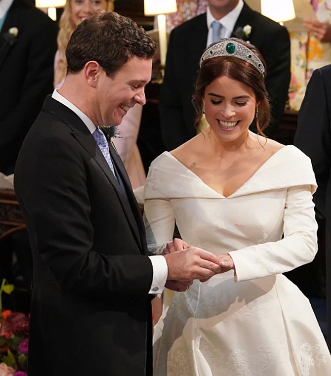 Jack Brooksbank and Princess Eugenie of York exchange rings during their wedding ceremony at St. George's Chapel. Photo Getty