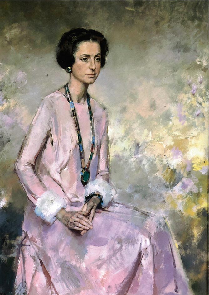 The private collector wearing her Bulgari gem-set and diamond sautoir in a portrait with a pink dress. Photo courtesy
