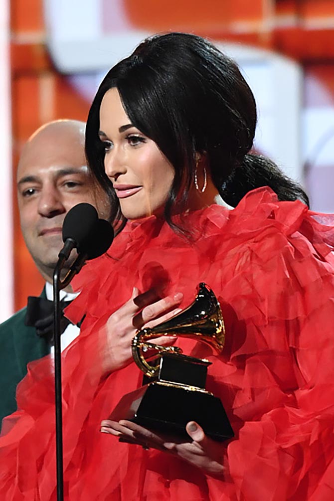 Kacey Musgraves wore hoops by Sara Weinstock with her Valentino to accept awards at the Grammys.