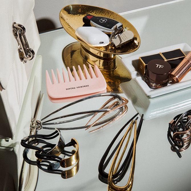 A still-life showing Deborah Pagani's hair pins and elastics as well as the wide comb that comes with her pieces. Photo courtesy