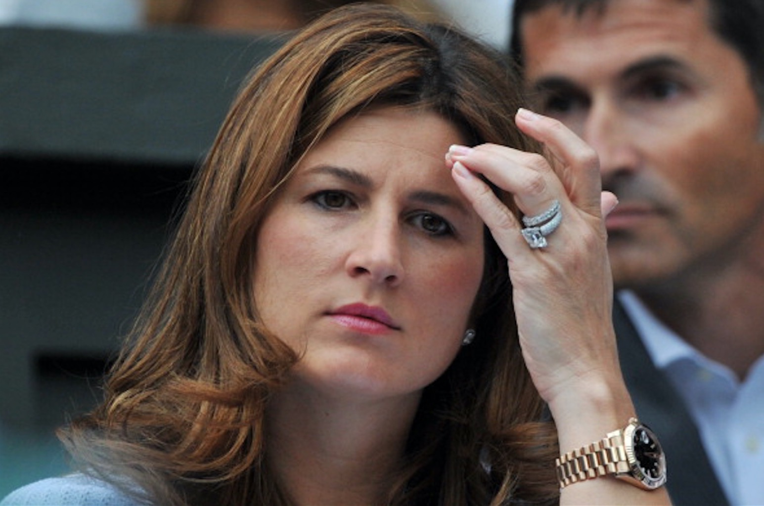 At the 2014 Wimbledon Championships, Mirka Federer watch her husband play while wearing her original emerald-cut diamond engagement ring and diamond wedding band. Photo Getty