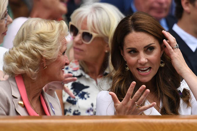 Kate Middleton wearing Catherine Zoraida earrings, a citrine cocktail ring and her engagement ring in the Royal Box Wimbledon. Photo 