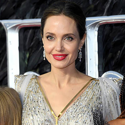 The Adventurine Posts See How Angelina Jolie’s Gold Corset Was Made