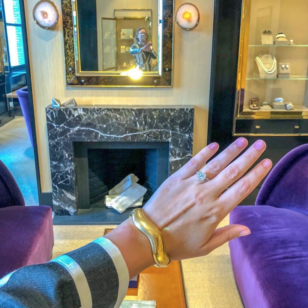 Gem X Co-Founder Heidi Kreamer-Garnet posing in a Belperron wave bracelet during the group's tour of the salon. Photo via Instagram @heidikreamergarnett