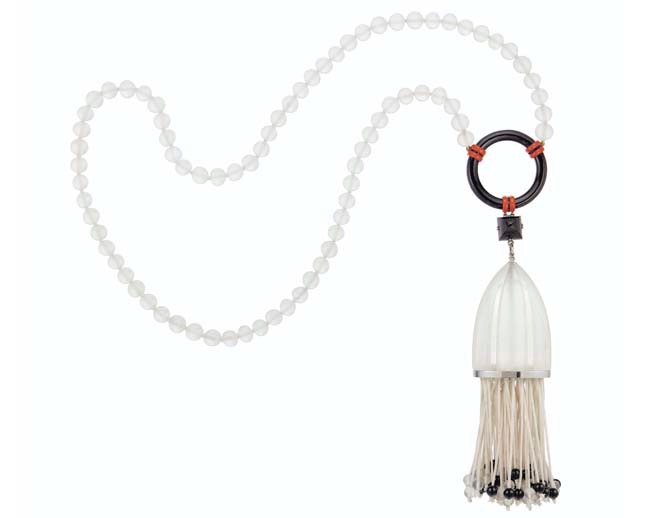 ART DECO ROCK CRYSTAL, ONYX, ENAMEL AND DIAMOND SAUTOIR, GEORGES FOUQUET Frosted rock crystal beads and carved dome, onyx hoop and beads, pyramidal-shaped onyx plaque, red enamel, single-cut diamonds, silk cord tassel, platinum, neckchain 31 ¼ ins., circa 1925, signed G. Fouquet