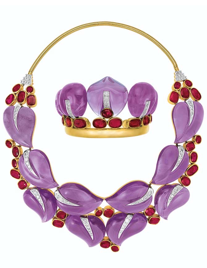 SET OF AMETHYST, RUBY AND DIAMOND 'LEAVES' JEWELRY, SUZANNE BELPERRON Carved amethyst leaves, cushion and oval-shaped rubies, old and single-cut diamonds, 18k gold and platinum (French marks), necklace 14 ins., cuff diameter 2 1/8 ins., circa 1936, unsigned, each with maker's mark (Groëné et Darde for B. Herz), navy blue B. Herz fitted cases