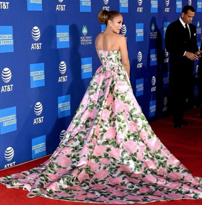 Jennifer Lopez wearing her emerald and diamond earrings with a Richard Quinn gown at the PSIFF. Photo via Instagram @jlo