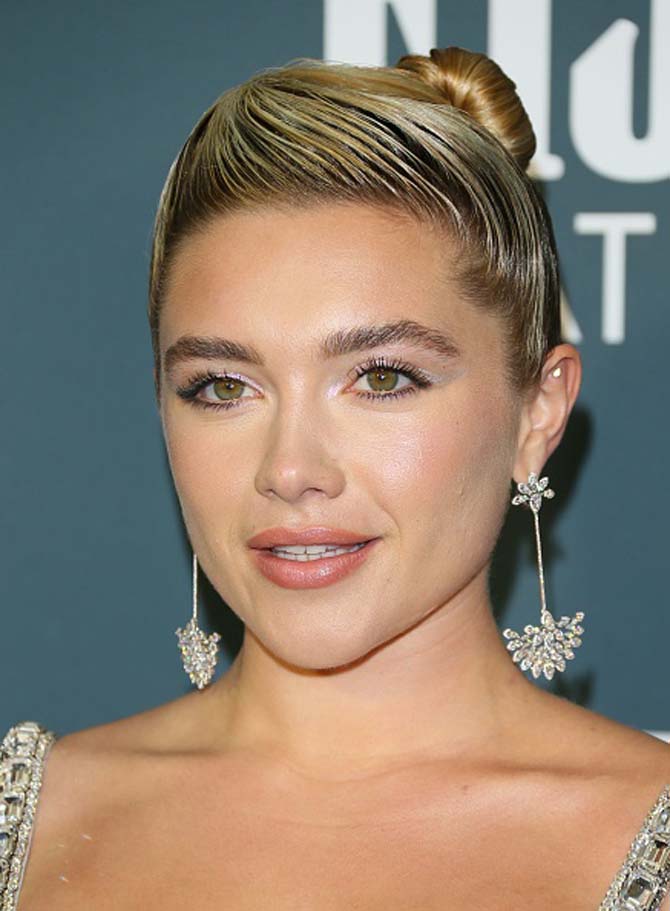 Florence Pugh wore earrings by Messika.