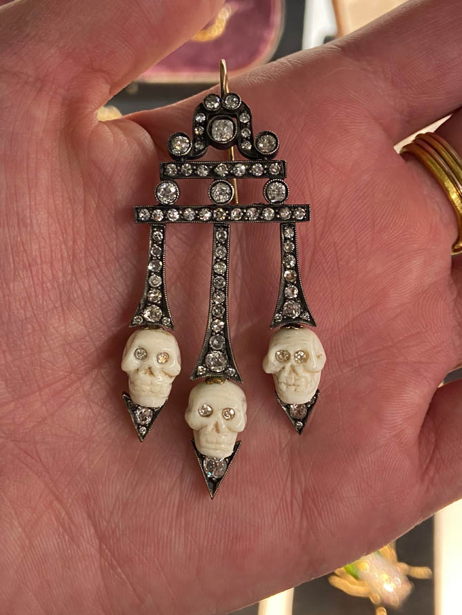 Antique earrings in silvered 18kt gold with old-mine-cut diamonds and six carved skulls from Il Mercante. Photo Kareem Rashed
