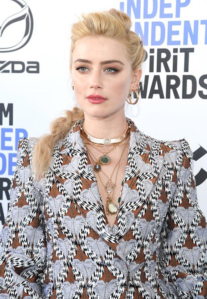 Amber Heard in a mix of her own jewels and Bulgari designs.