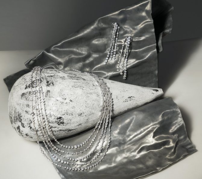 Disney's Cruella: Louis Vuitton handbag, De Beers jewellery
